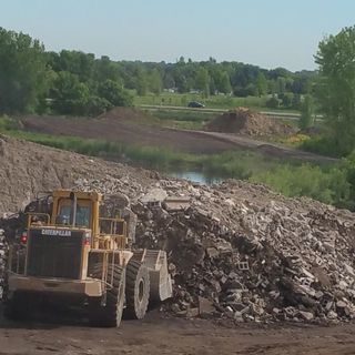 Tractor Piling The Rocks — Recycling Services in Medina, MN
