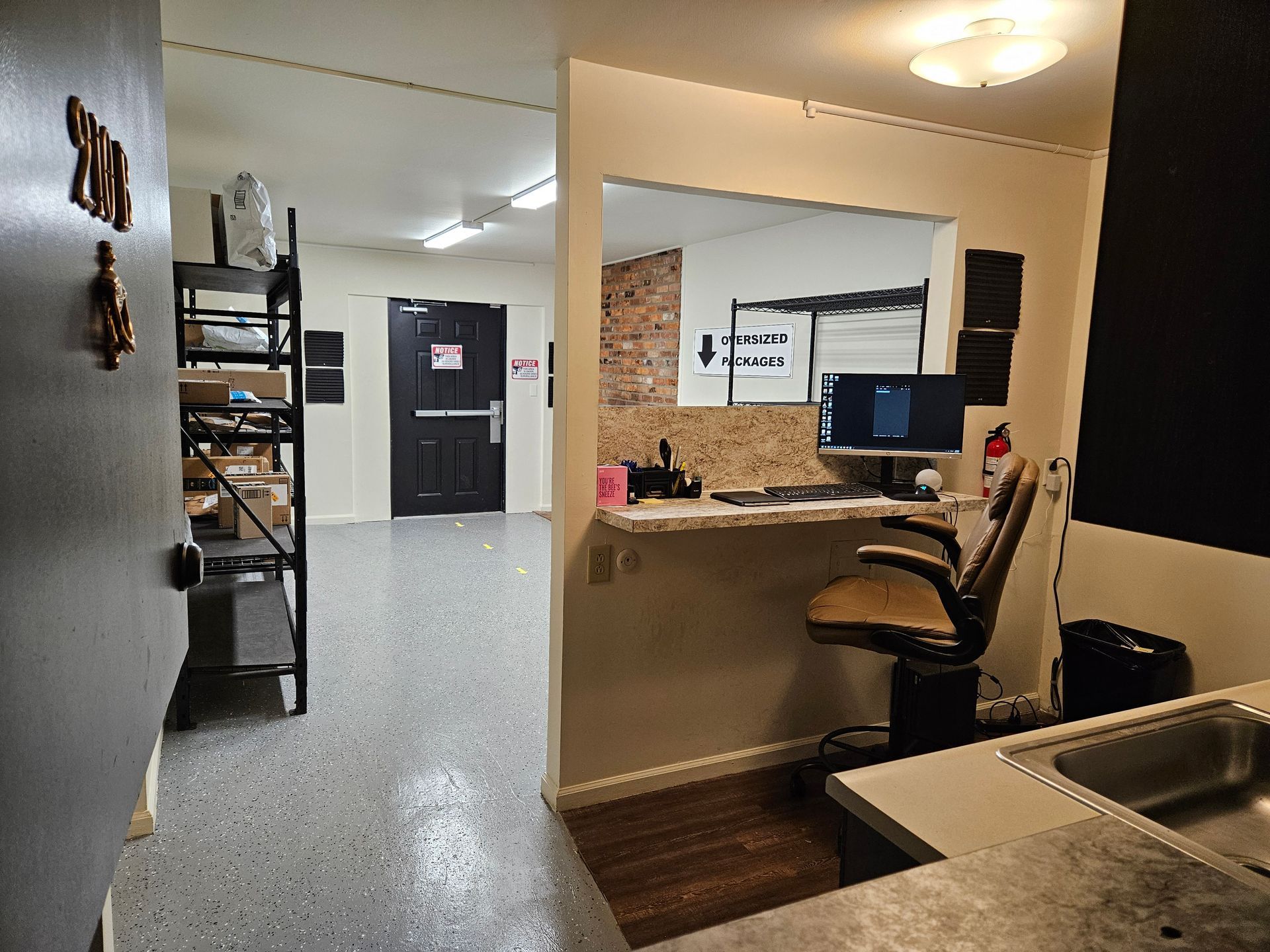 A room with a desk and a computer in it