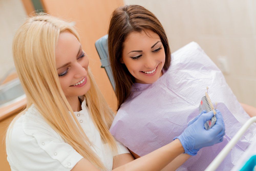 A patient getting dental crowns in Rochester, NY