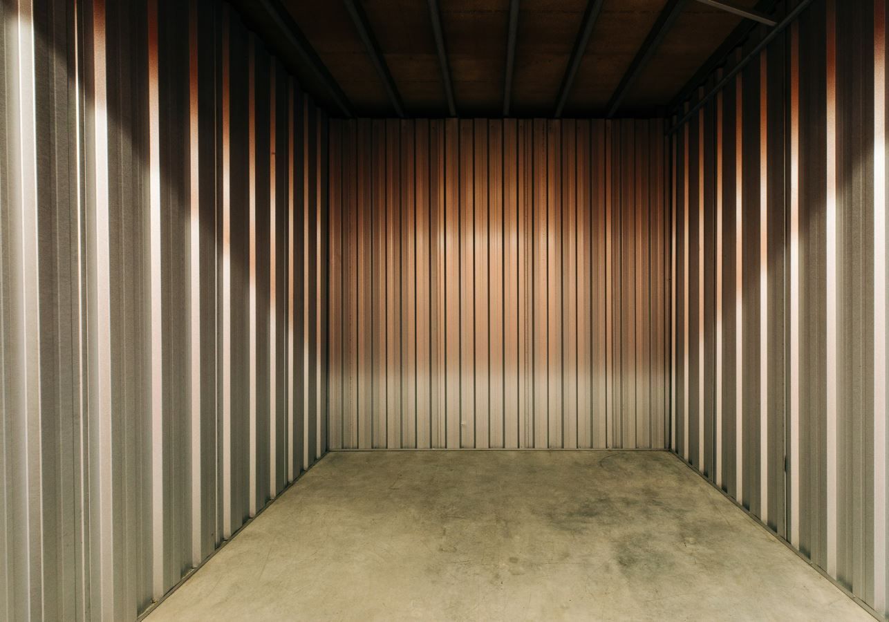 Empty Storage Unit With Corrugated Metal Walls — Storage Aus In Canning Vale, WA
