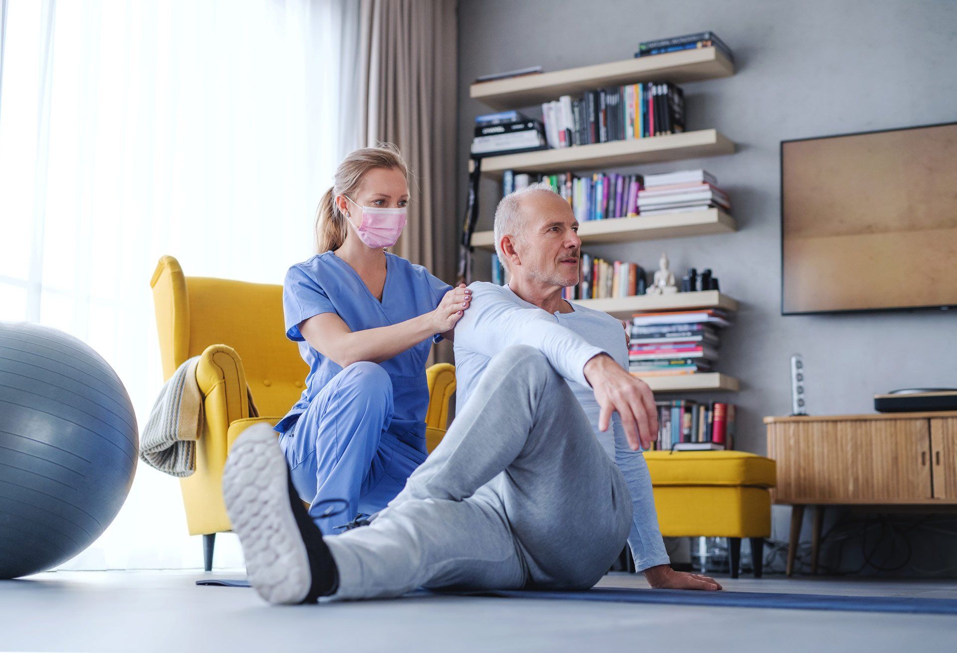 Physiotherapist with Face Mask Helping Senior Man to Exercise | Dapto, Nsw | Dapto Physiotherapy & Sports Injury Clinic