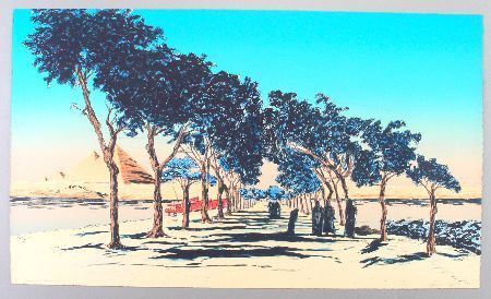 A row of trees shades a path. Pyramids and water are in the distance under a blue sky.