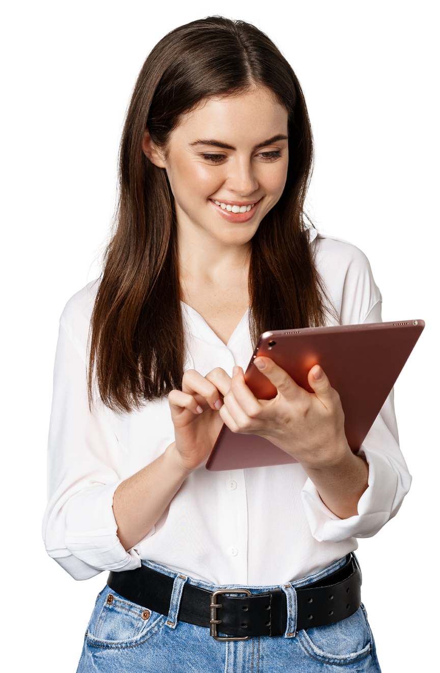 A woman is using a tablet computer and smiling.