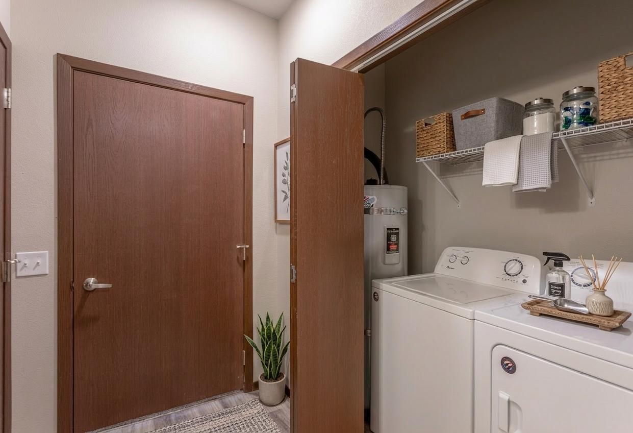 GIRL HOLDING FOLDED SWEATERS