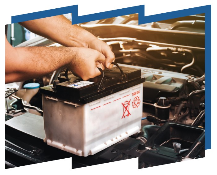 A man is fixing a car battery with a wrench.