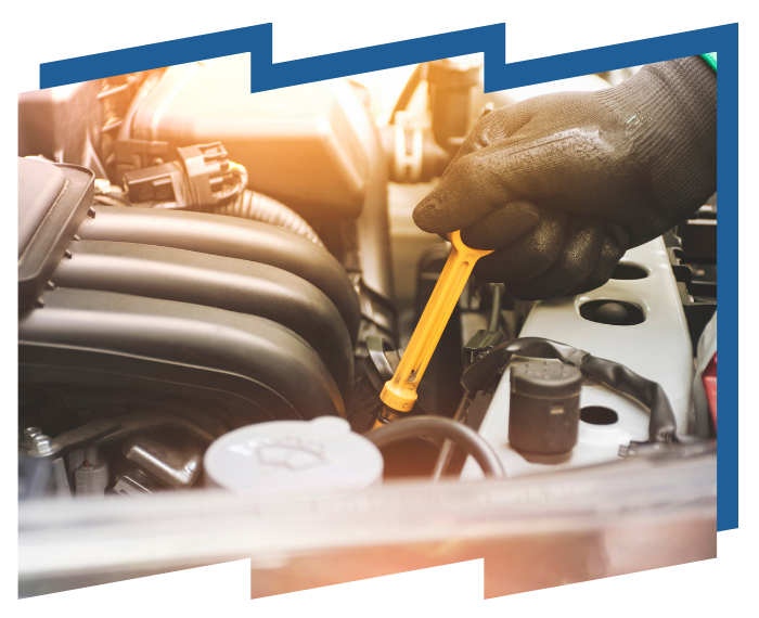 A person is checking the oil in a car with a wrench.