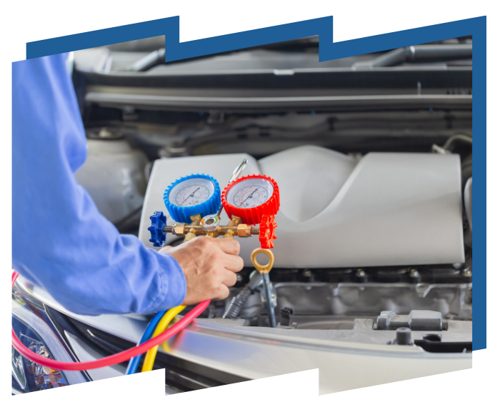 A man is working on the engine of a car.