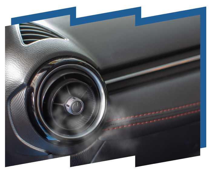 A close up of a car air vent with steam coming out of it
