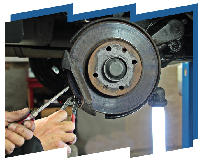 A person is working on a brake disc on a car.