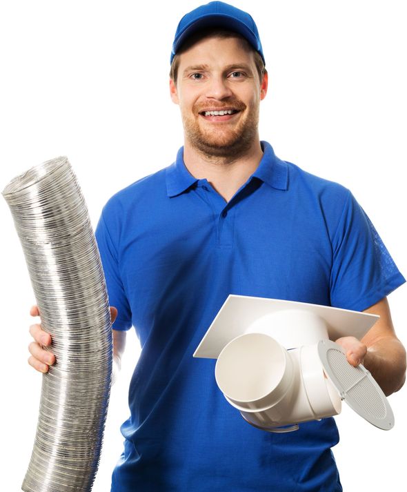 A man in a blue shirt is holding a duct and a fan.