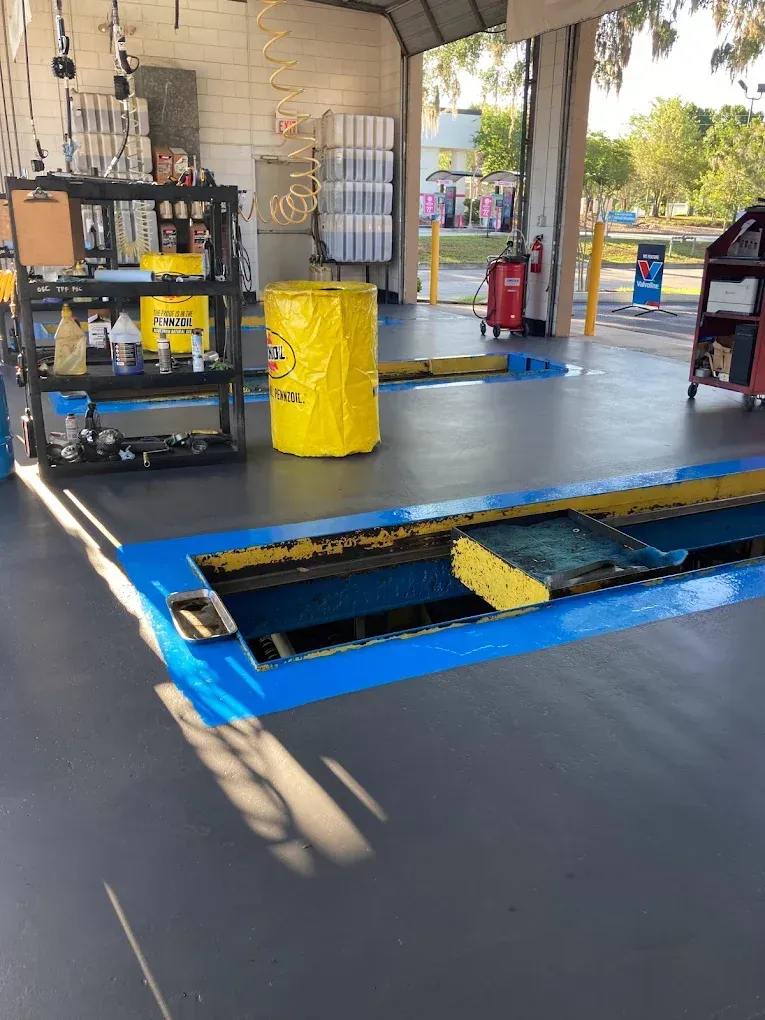 A garage with a yellow barrel in the middle of it