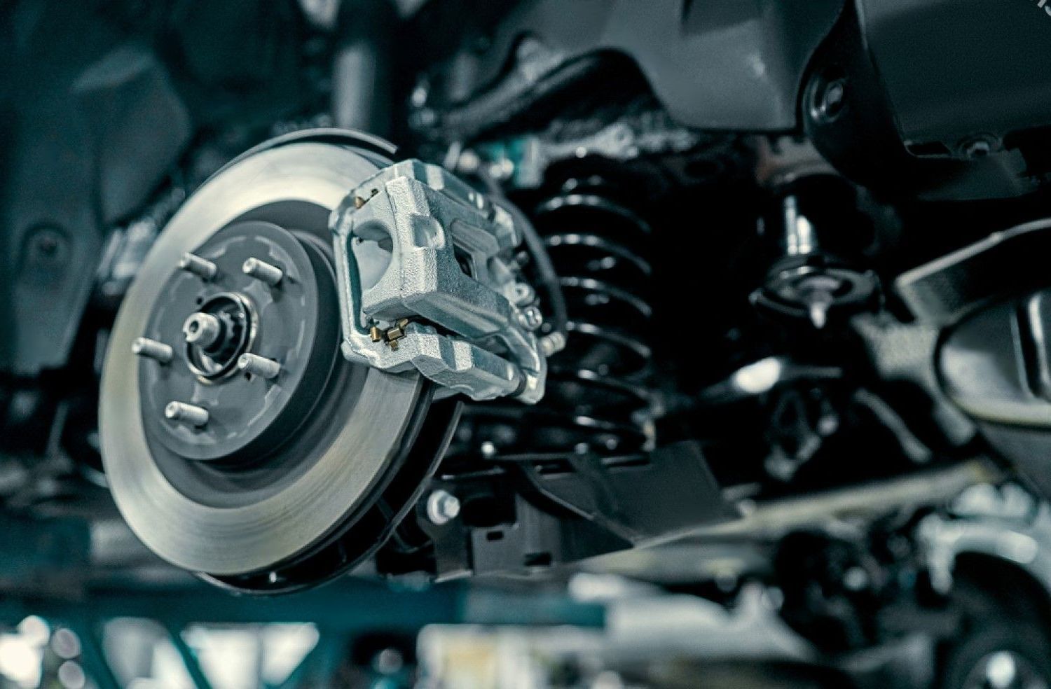 A close up of a brake disc on a car.