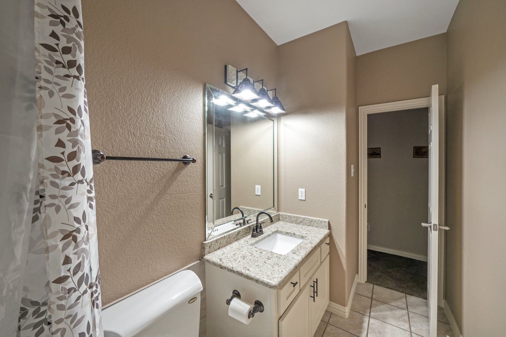 New tan bathroom renovation side