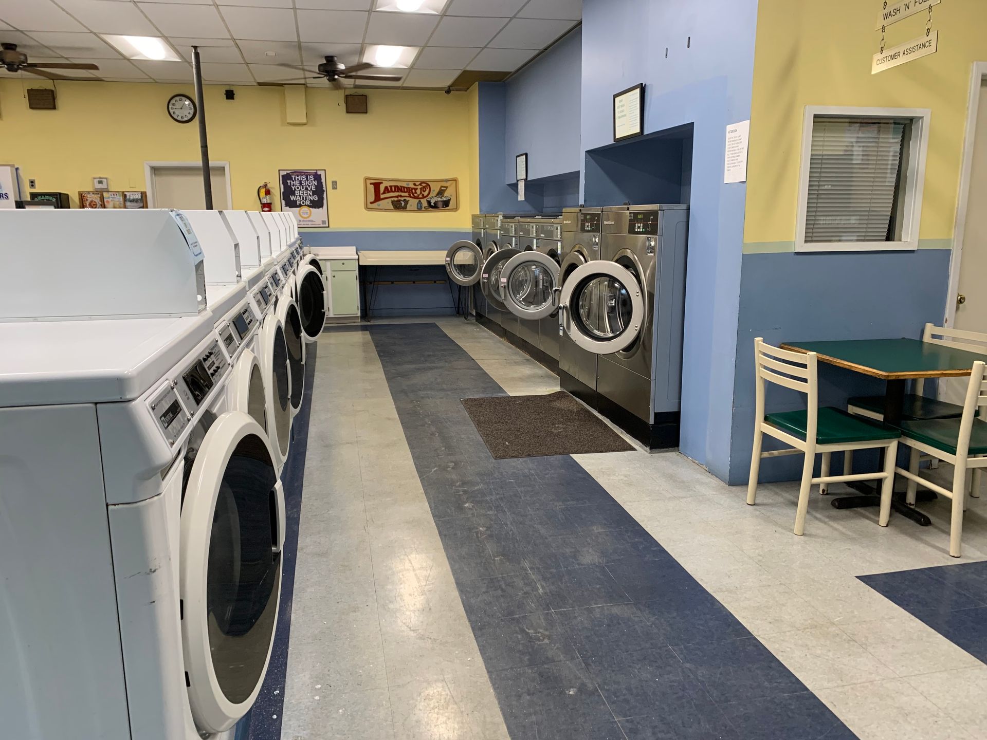 A laundromat with a lot of washers and dryers