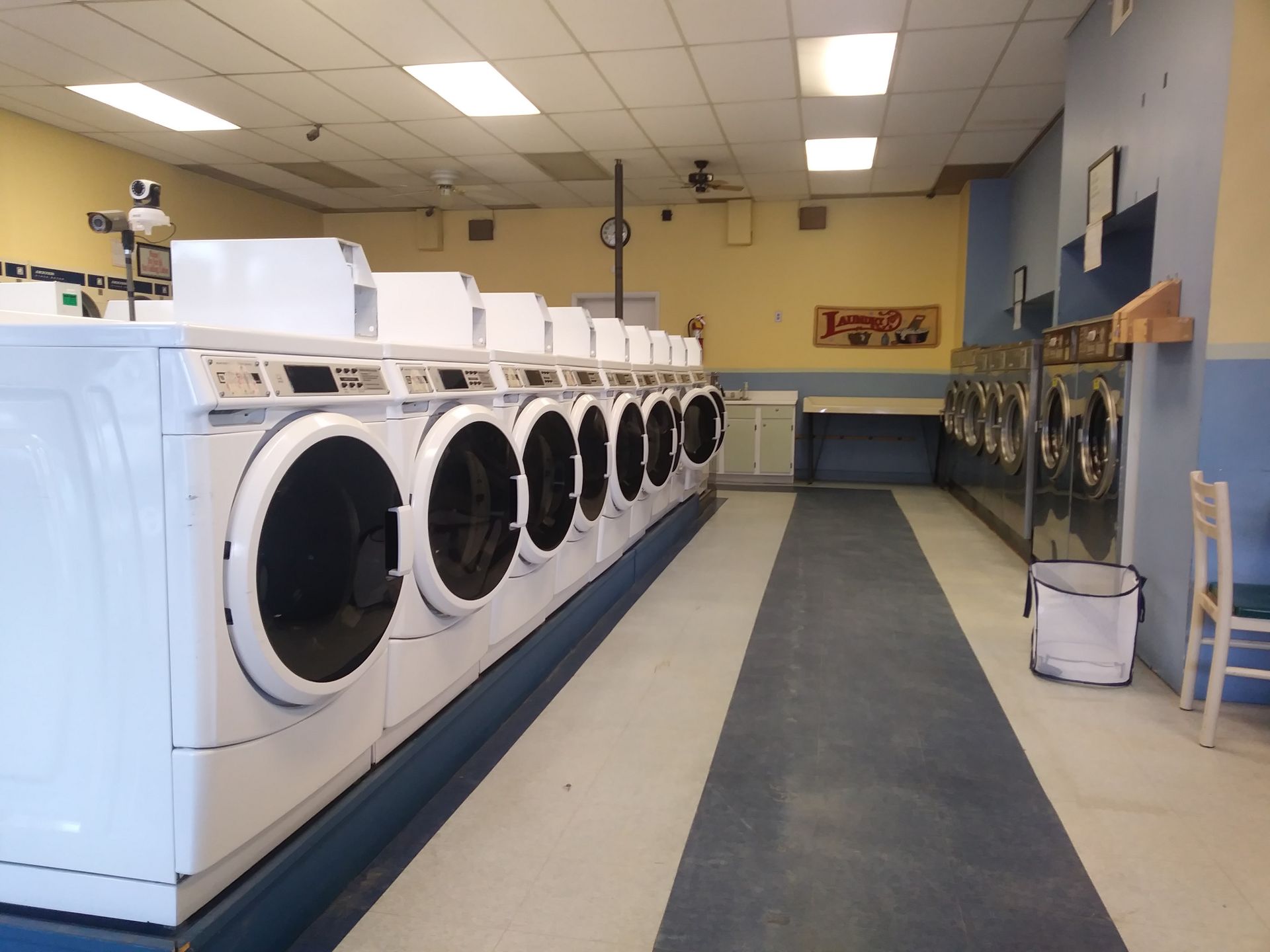 A laundromat with a lot of washers and dryers