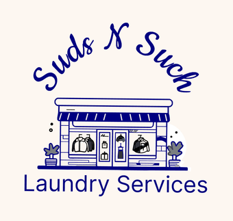 A woman is holding a stack of towels in a laundromat.