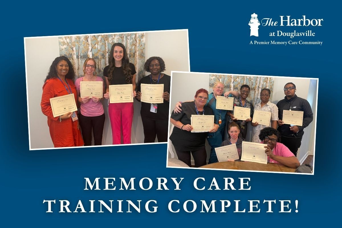 A group of people are standing next to each other holding certificates.