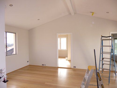 room with white walls and wood flooring