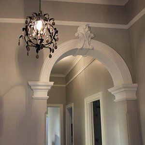 hanging light in room with archway