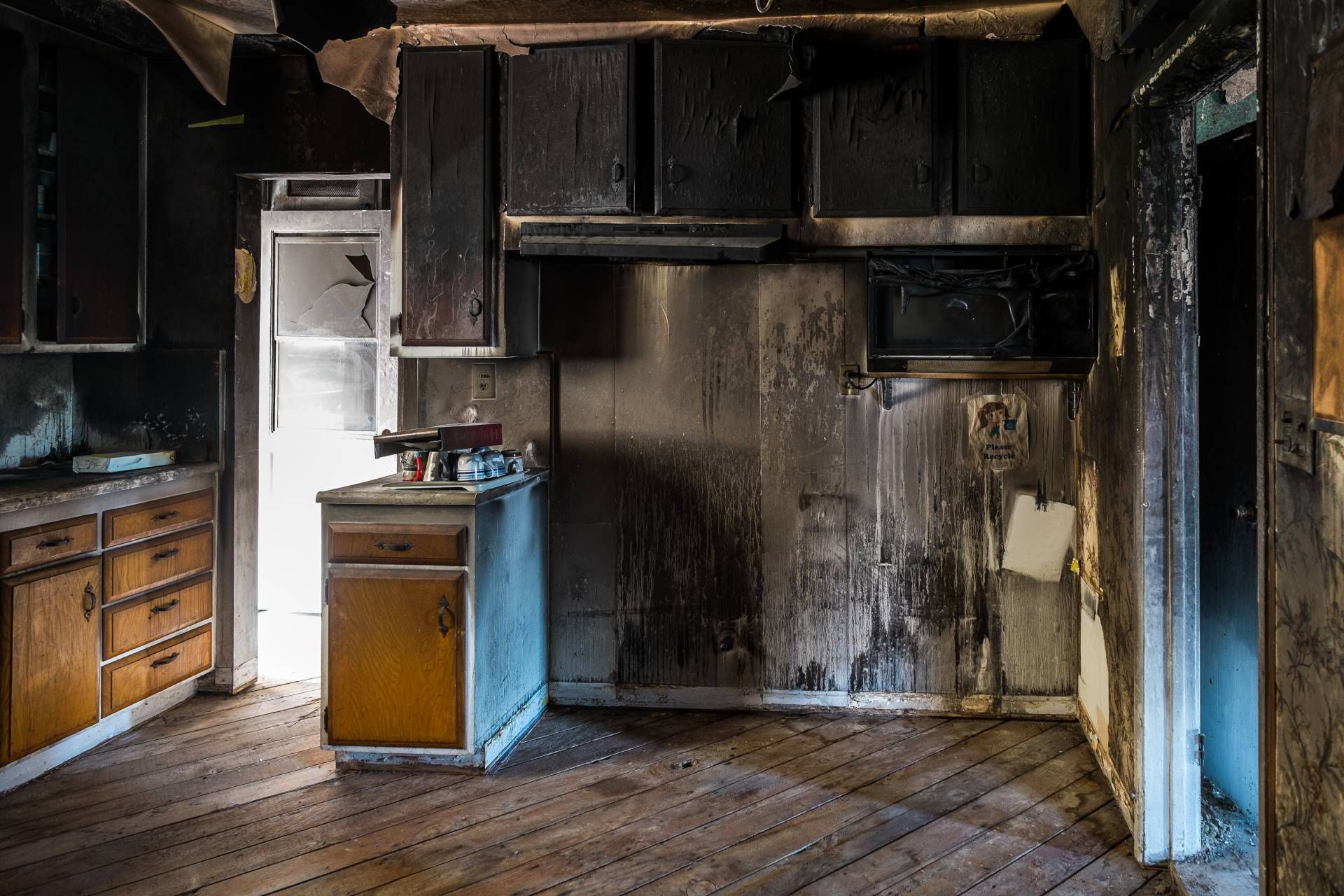 A kitchen that has been damaged by a fire.