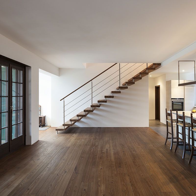 A wooden staircase leading up to the second floor of a house