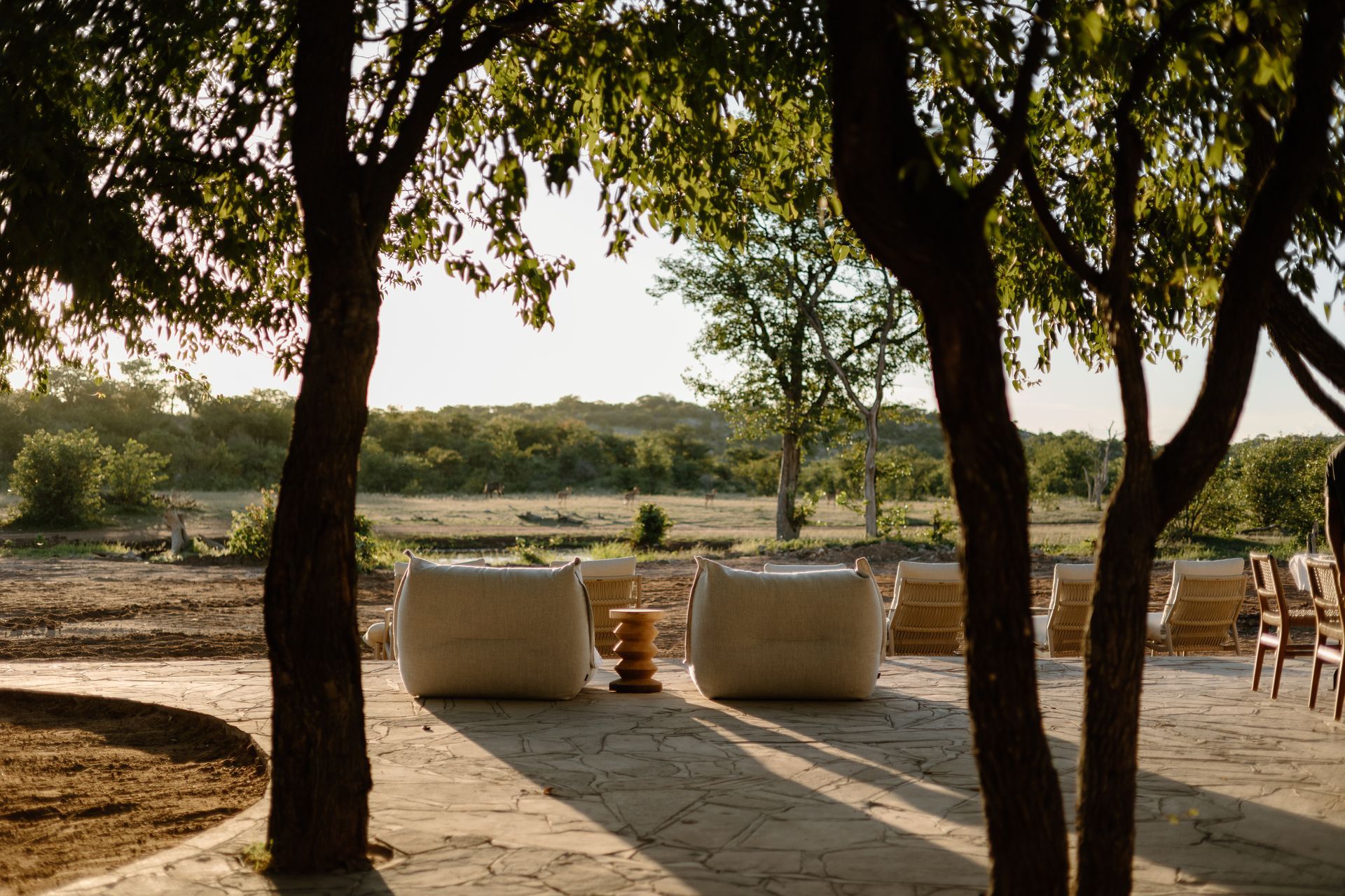 A bedroom with a canopy bed and a couch