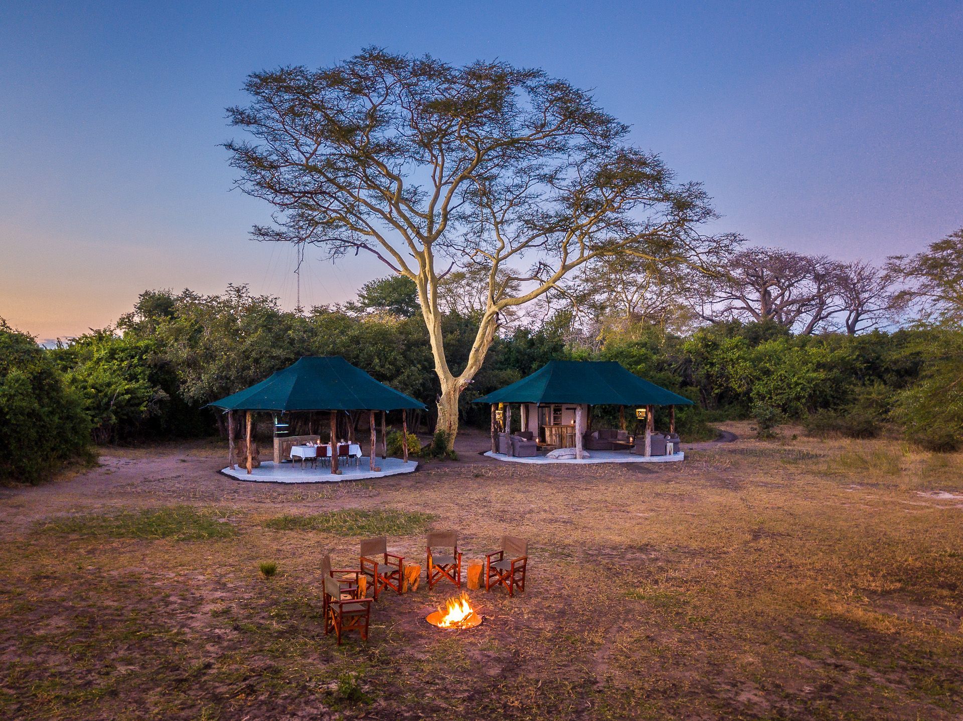 There is a fire pit in the middle of the field.