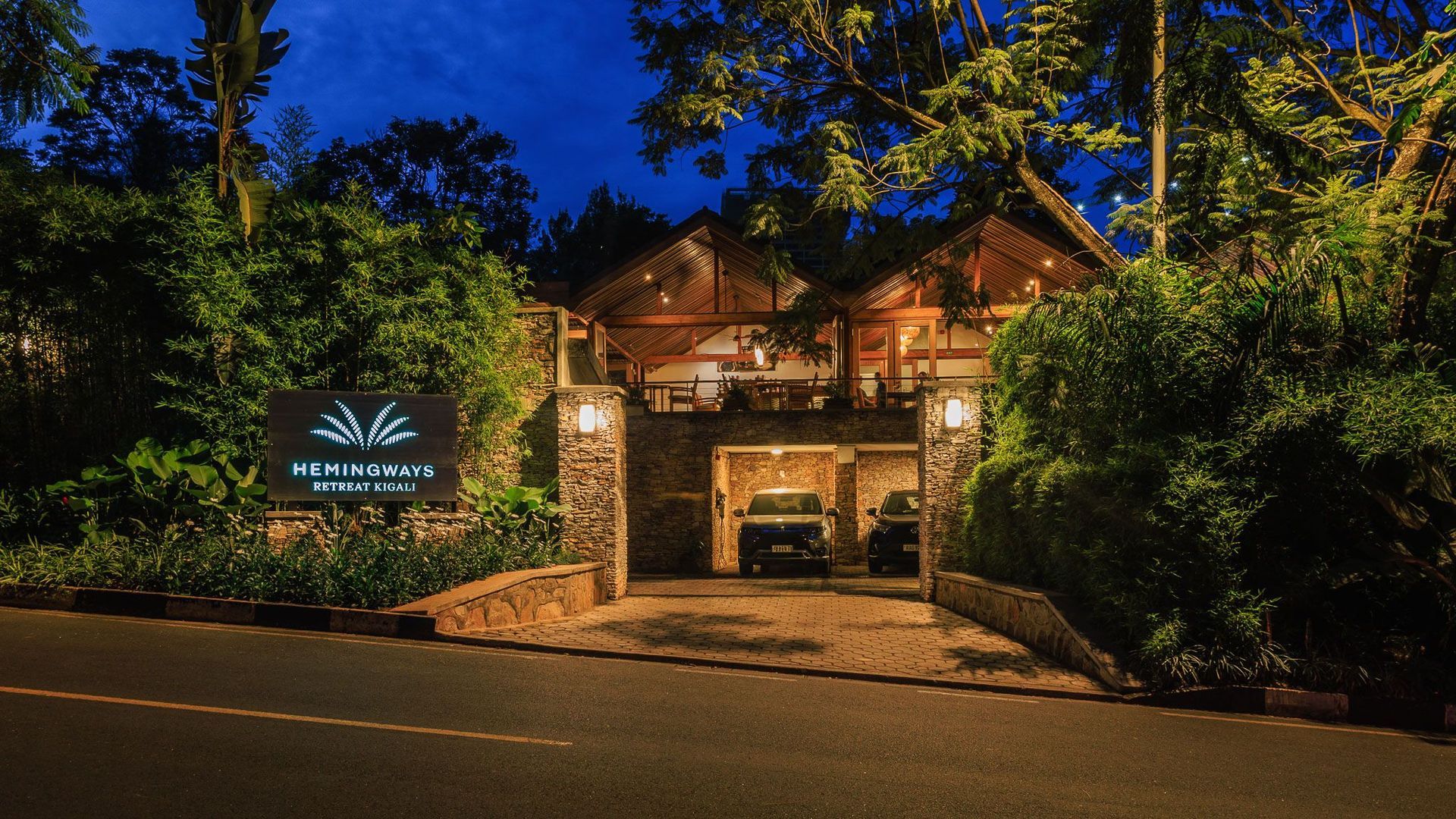 A living room with a couch , chair , table and bed.