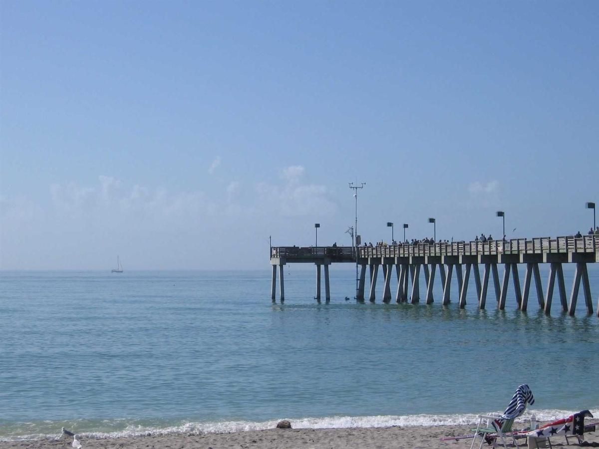 A pier in the middle of a body of water