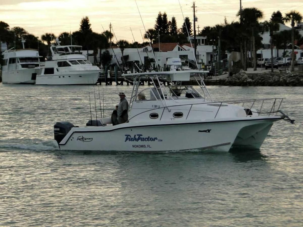 A white boat with the name rickfoster on the side