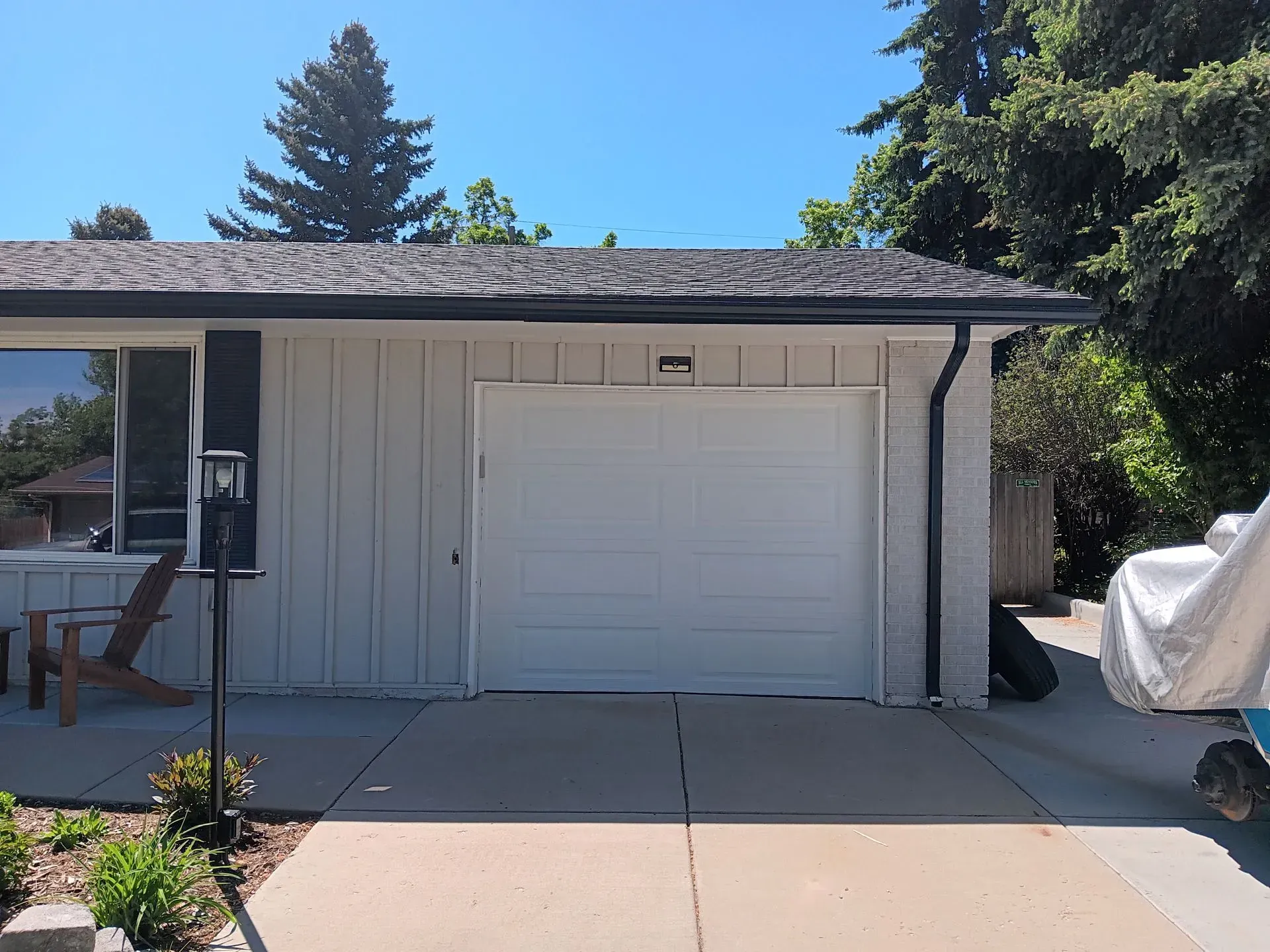 A white house with a white garage door