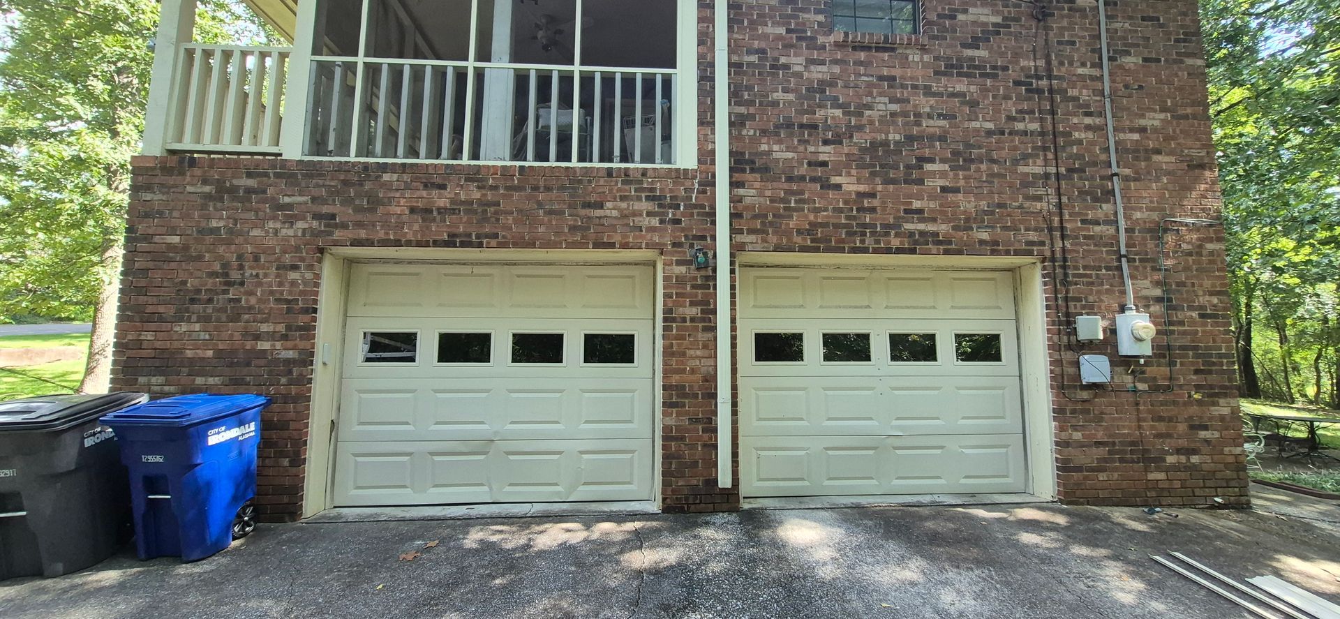 A before picture of a garage door in a garage.