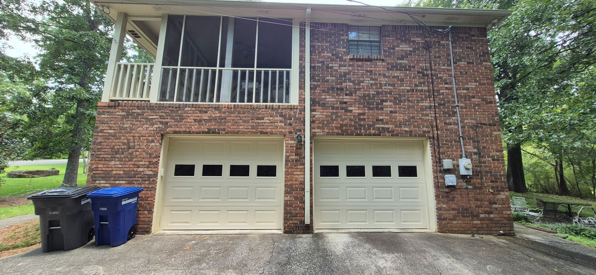 A picture of a garage door before and after being repaired.