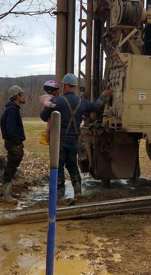 Workers and a little girl | Middleburg, PA | Zechman Well Drilling