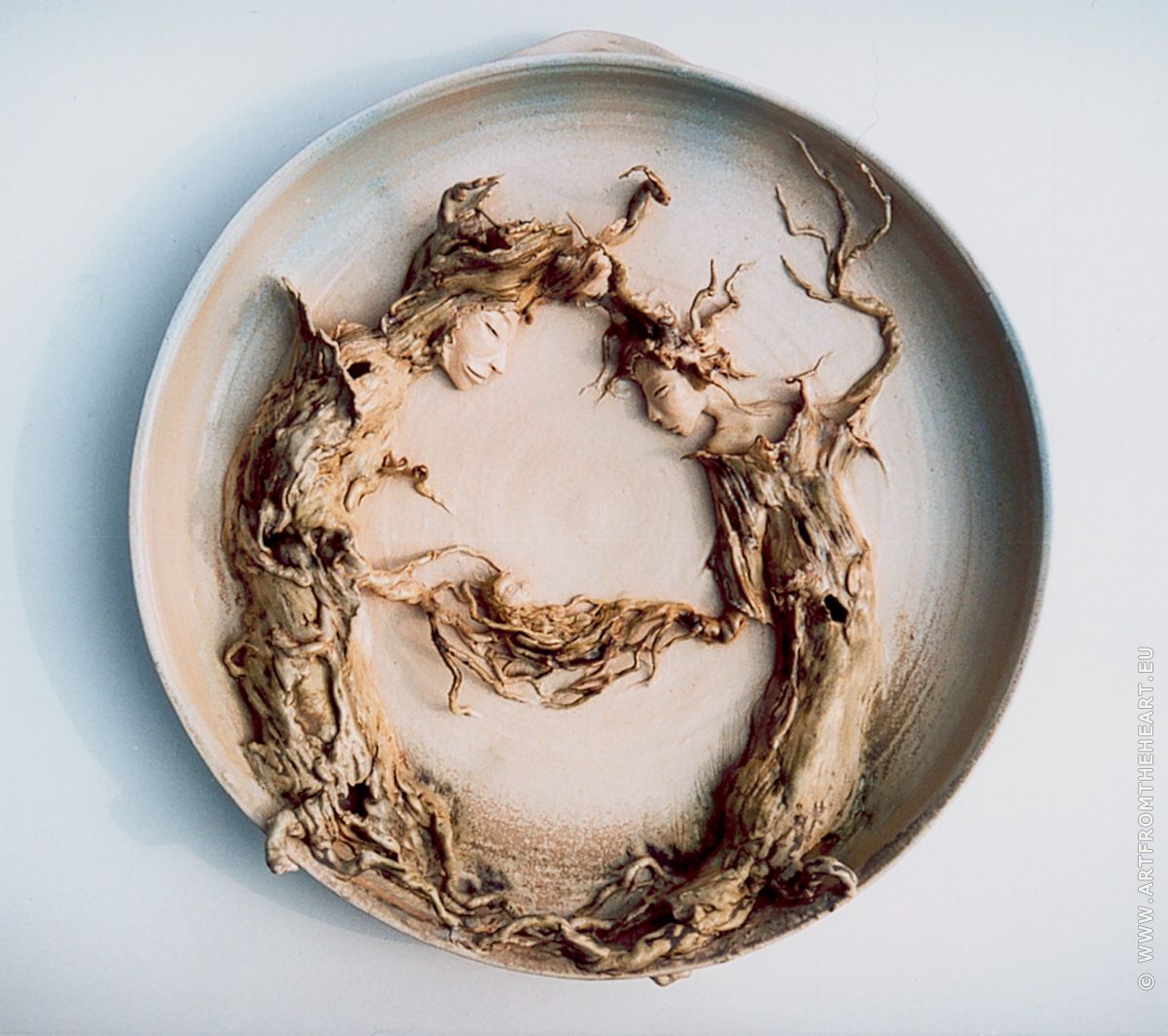 Nestwarmte, keramiek wandbord