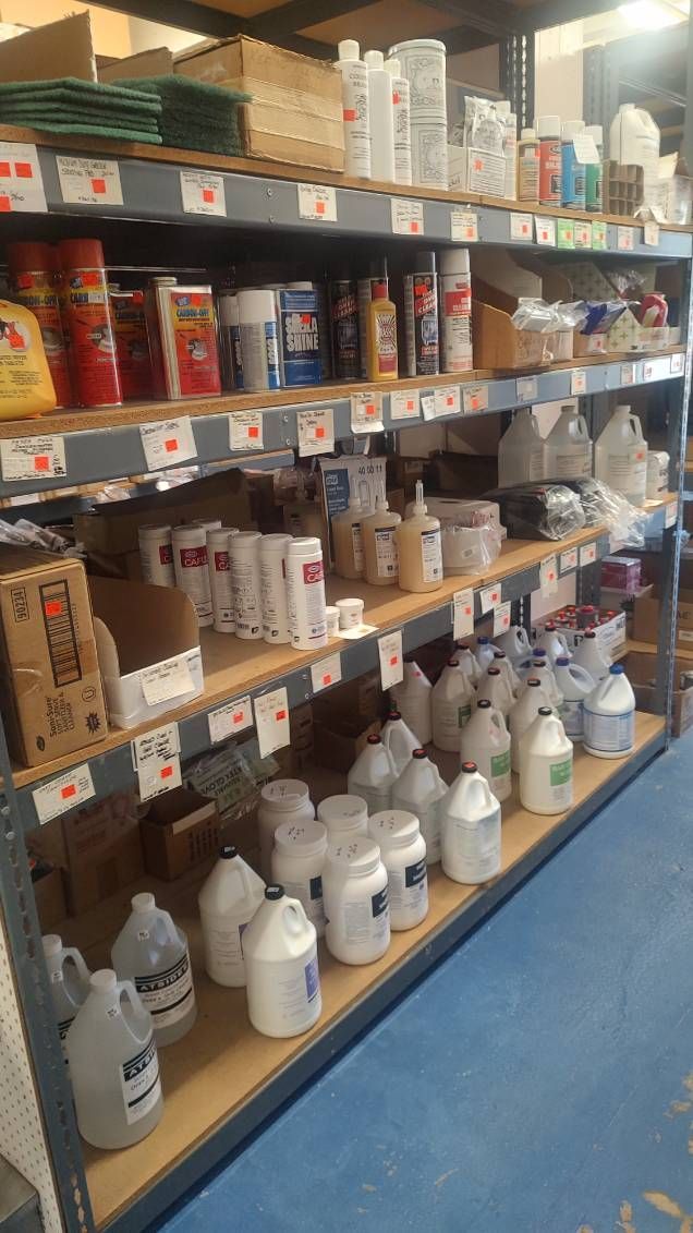 A warehouse filled with shelves filled with lots of chemicals.