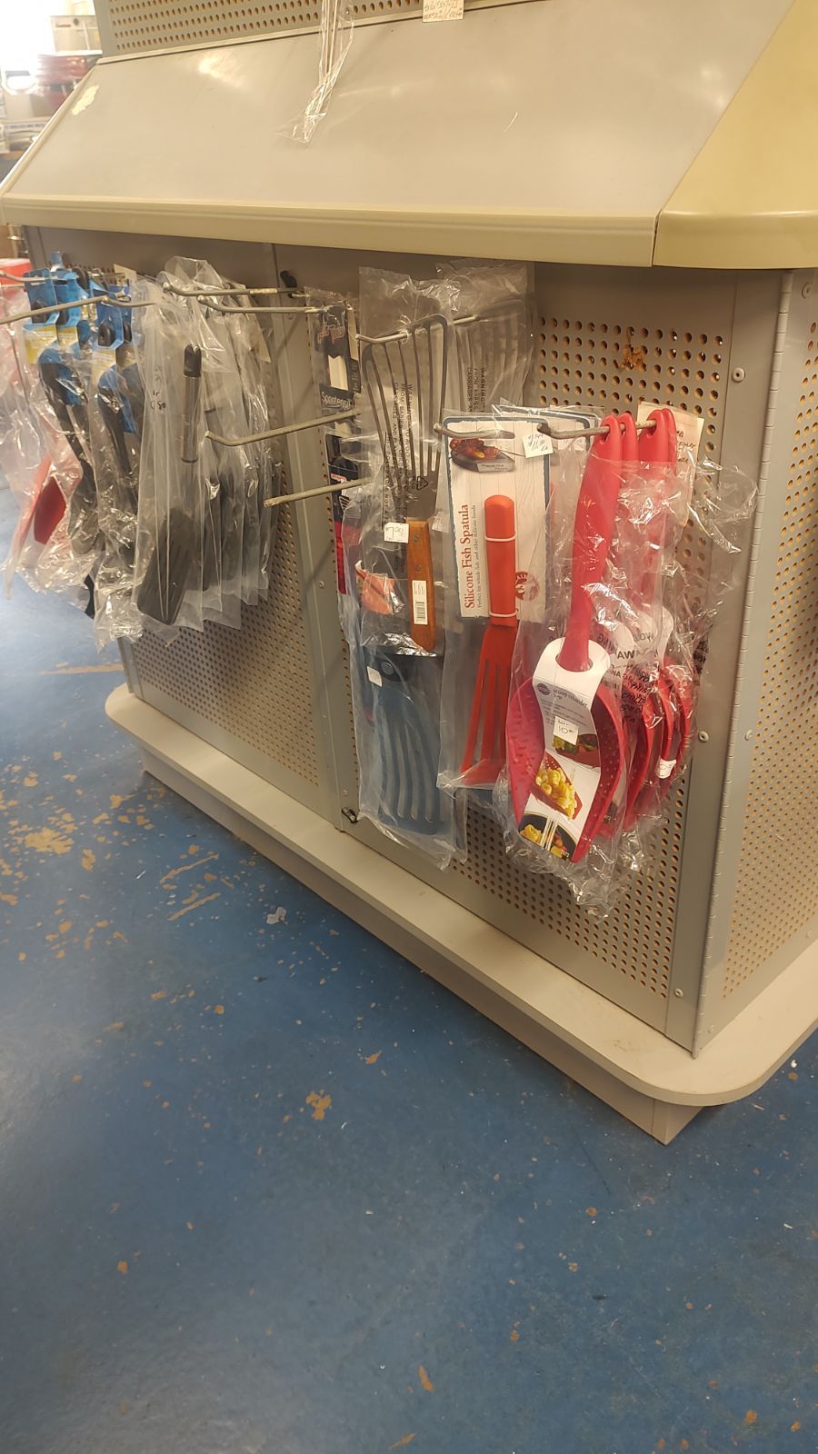 A display case with a bunch of items on it in a store.