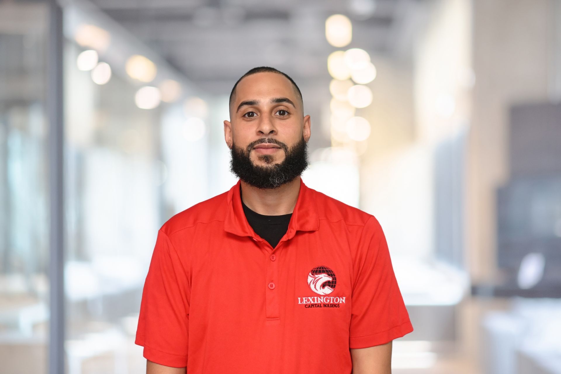 Damian Diaz in a Red Lexington polo smiling