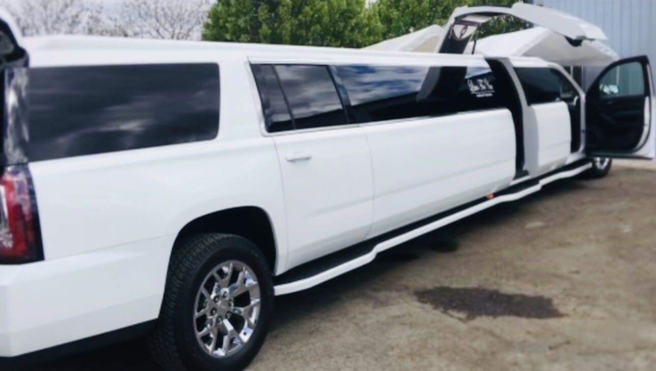 white stretch limo with jet door