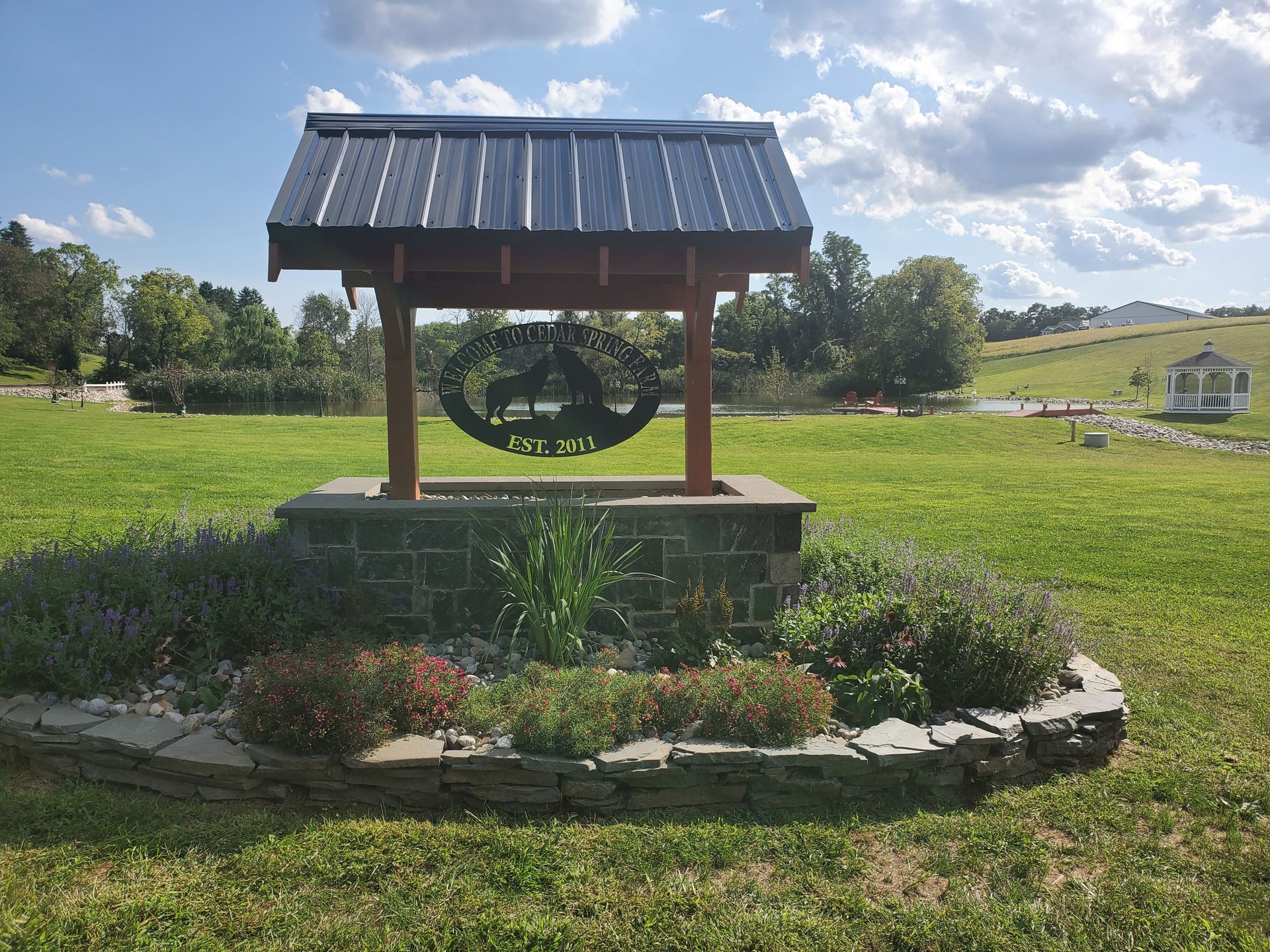 A well in the middle of a grassy field