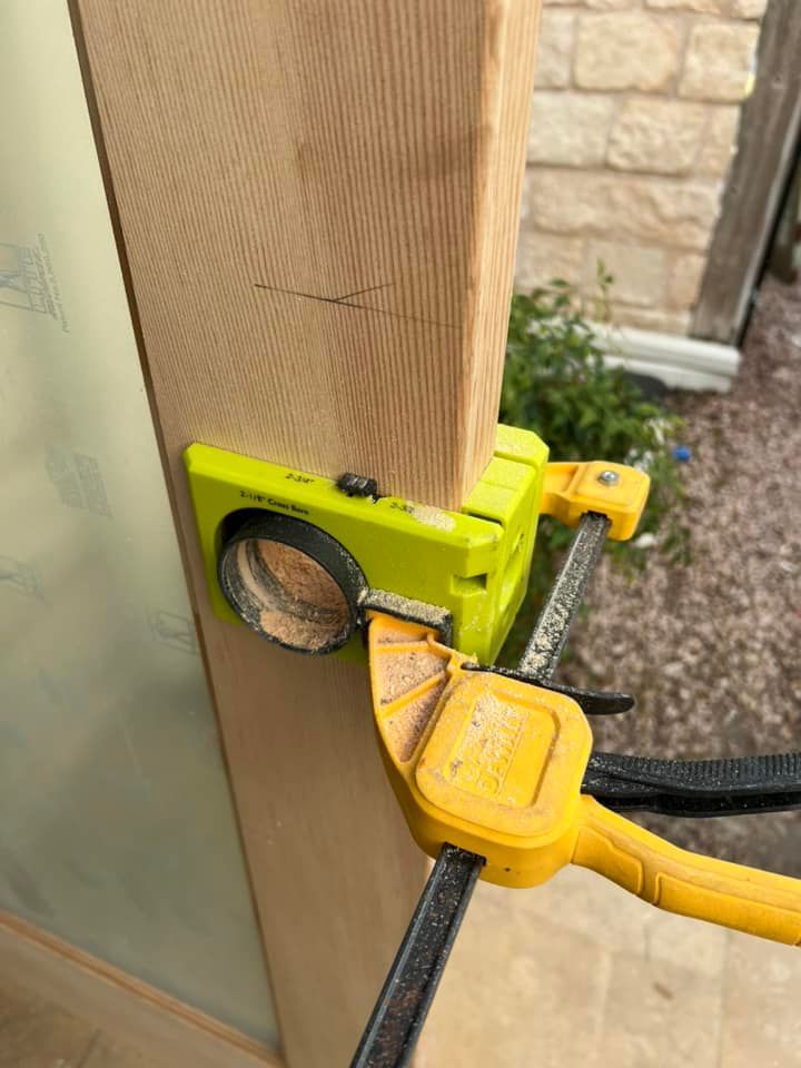 A wooden fence with a gate attached to it.