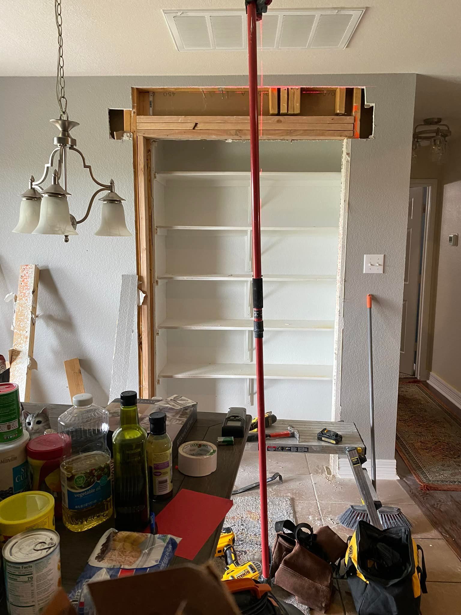 A pantry being constructed inside a wall. 