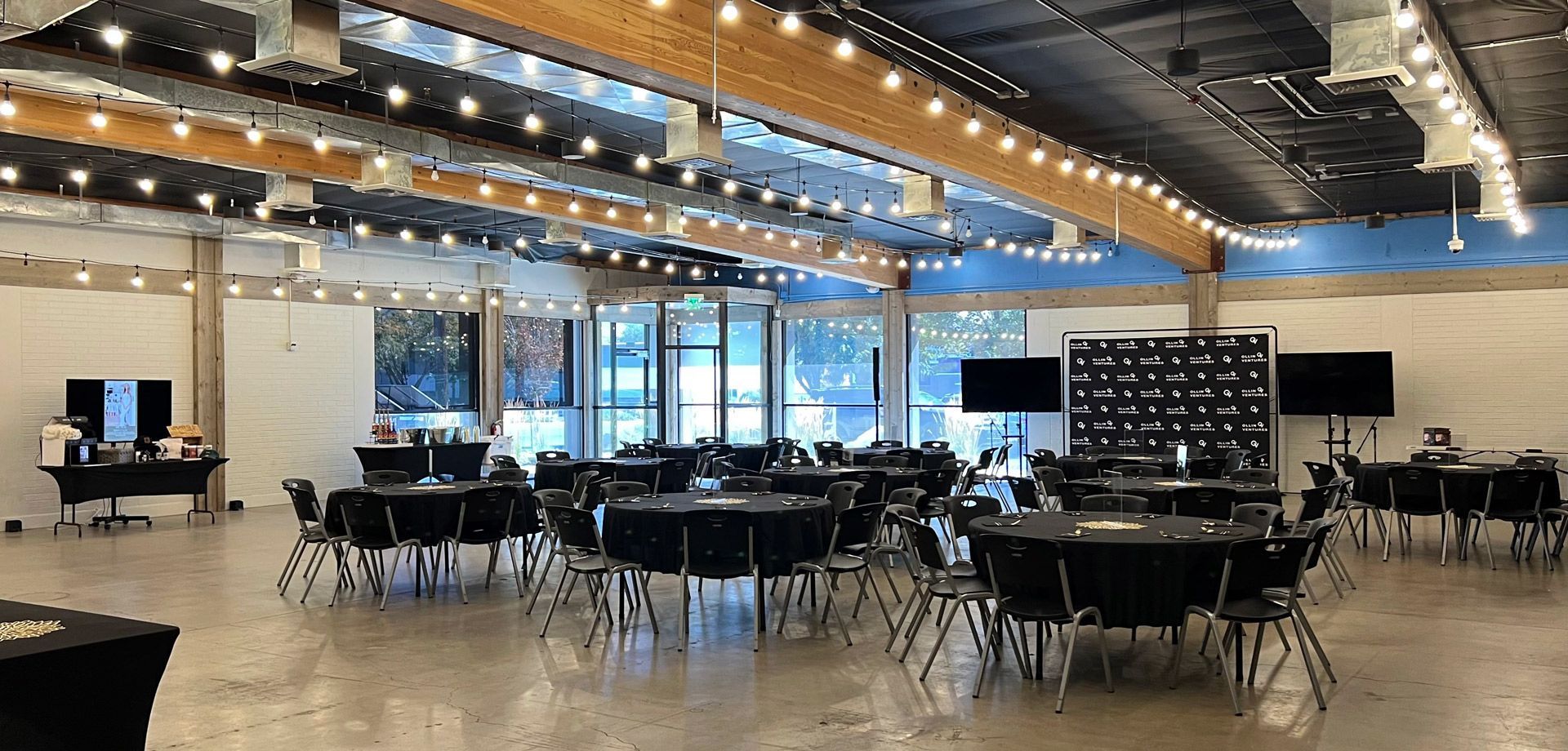 A large room filled with tables and chairs.