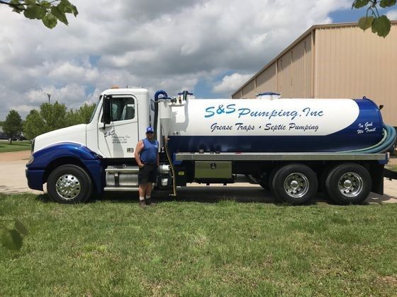 Man standing beside a truck — Branson, MO — S & S Pumping, Inc.