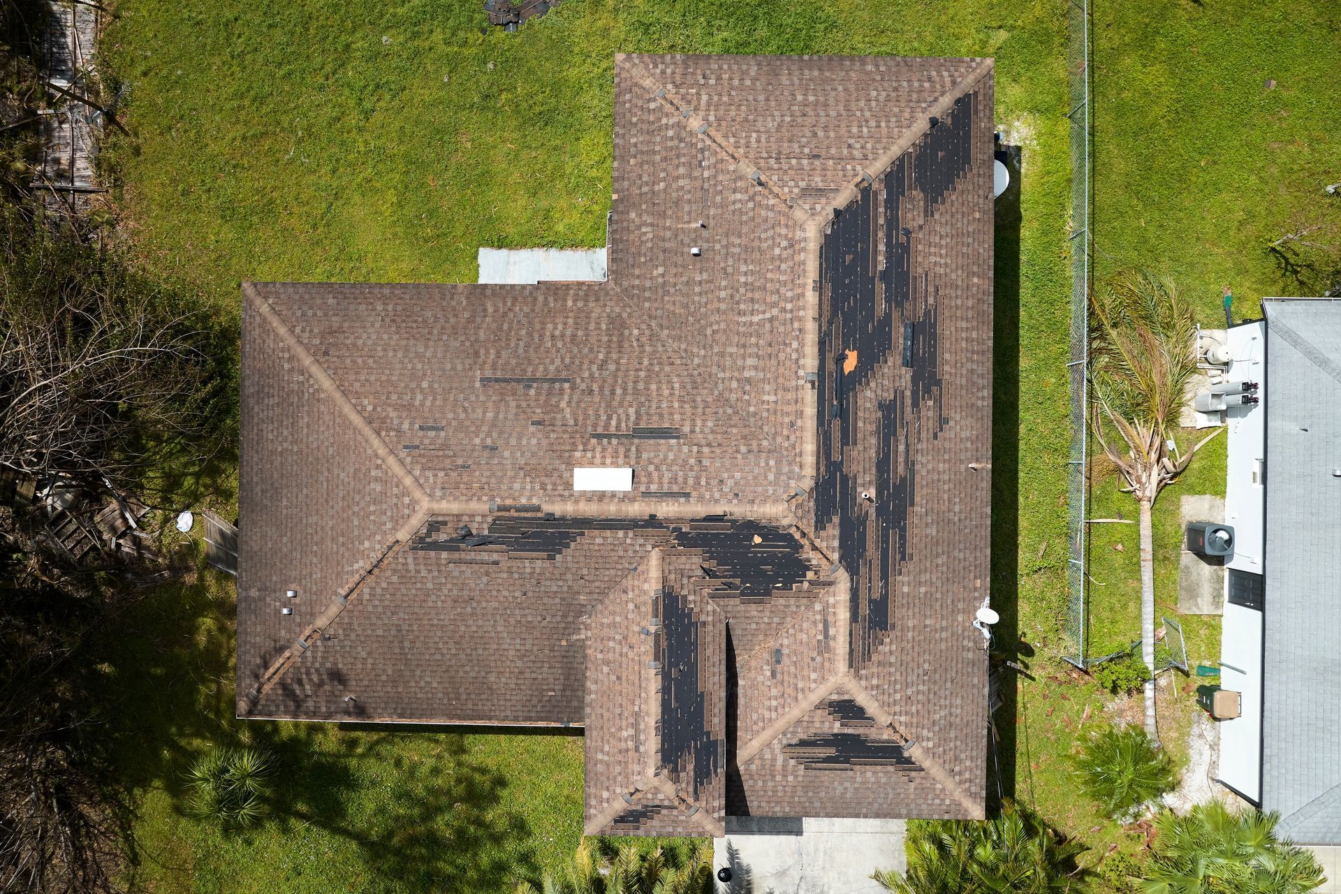 Roof damaged by strong wind and hurricane conditions