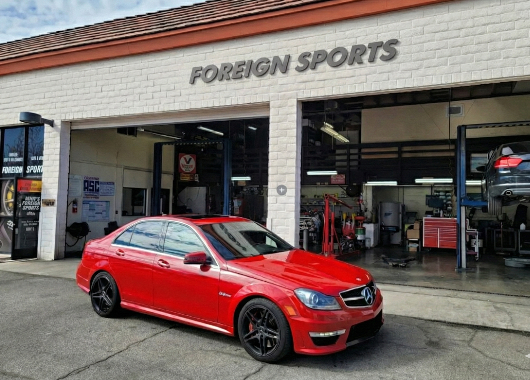 Red car parked in front of 