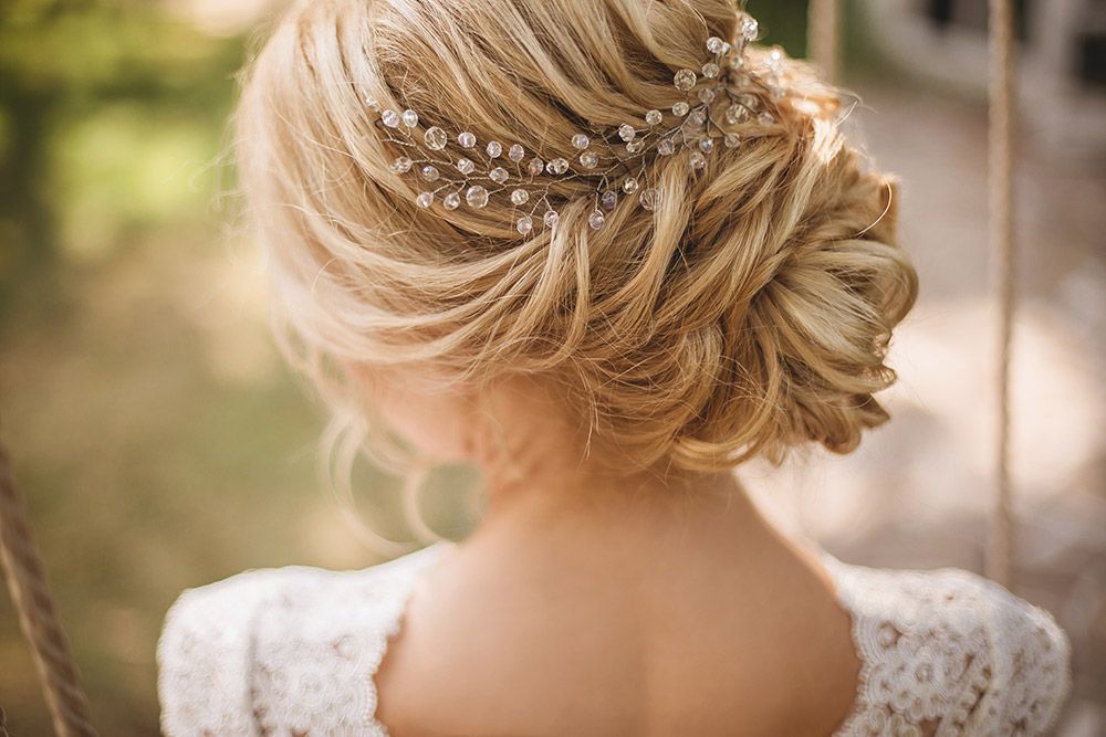 The Back of a Woman Wearing a White Dress and a Bun With Pearls in Her Hair — Lush Hair Studio in Tumbi Umbi, NSW