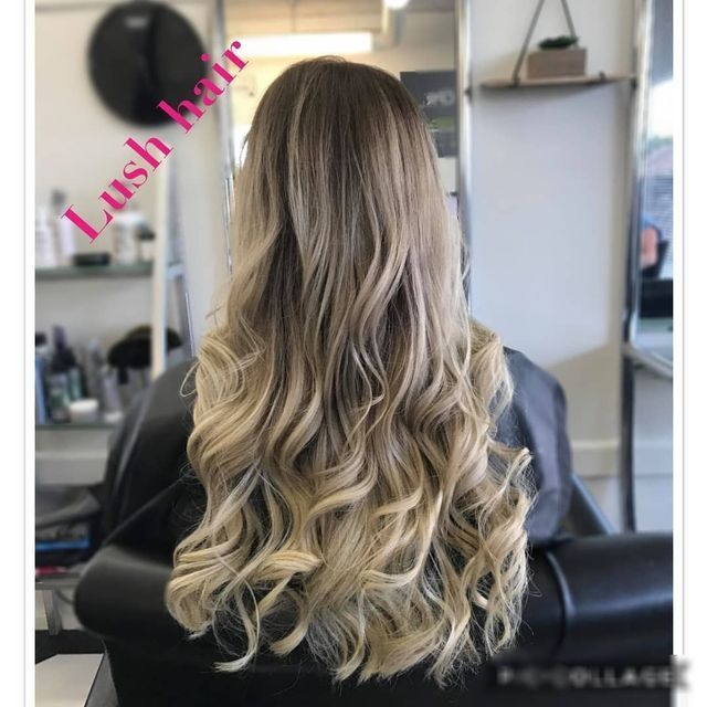 A Woman With Lush Hair is Sitting in a Chair — Lush Hair Studio in Tumbi Umbi, NSW