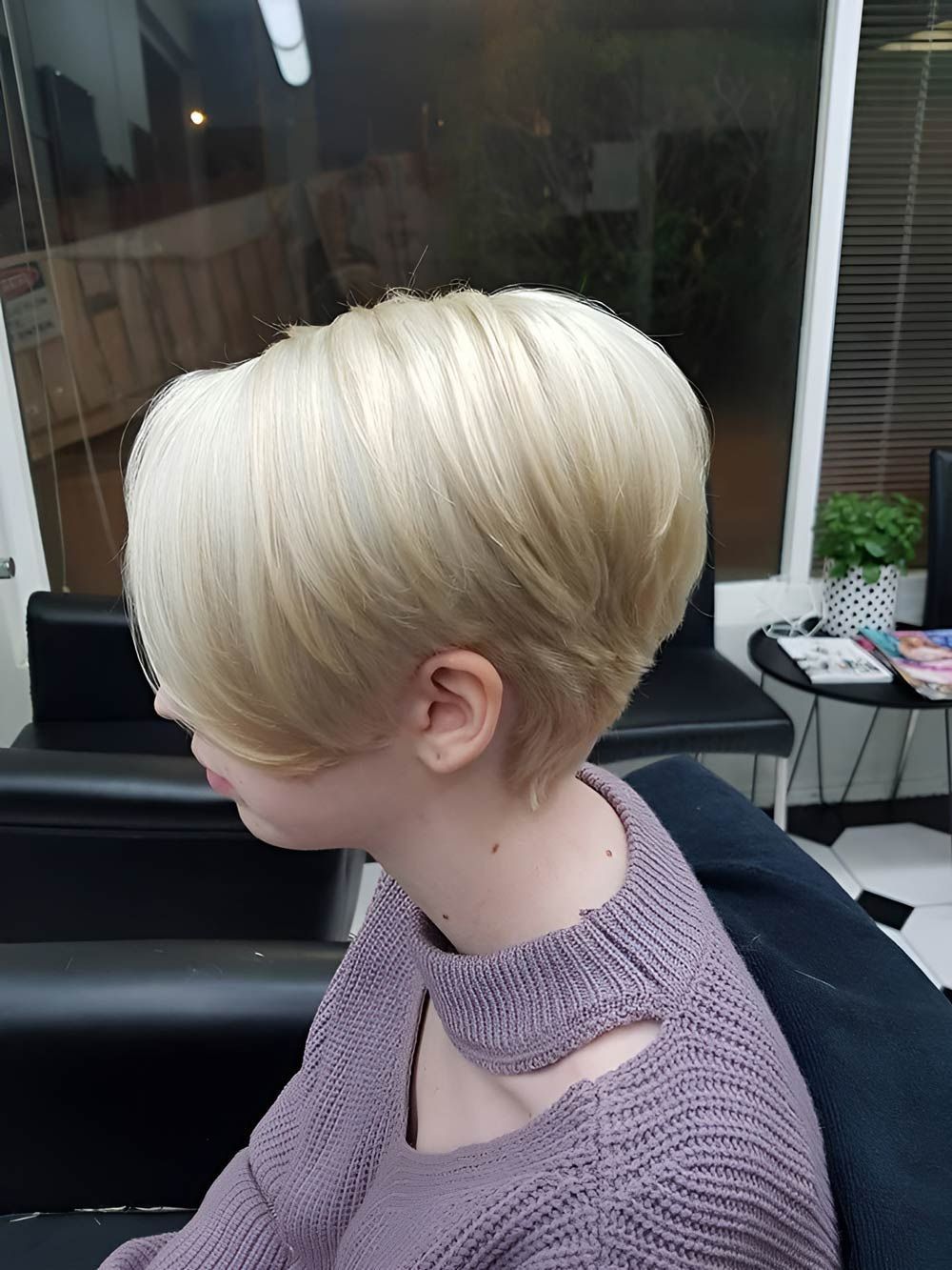 A Young Person With Short Blonde Hair is Wearing a Purple Sweater — Lush Hair Studio in Tumbi Umbi, NSW
