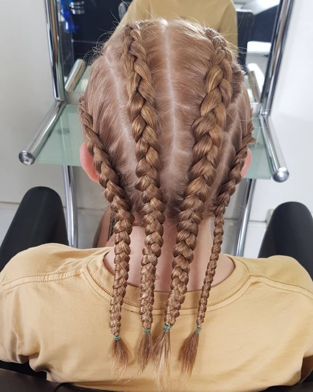 A Girl With Braids in Her Hair is Sitting in a Chair — Lush Hair Studio in Tumbi Umbi, NSW